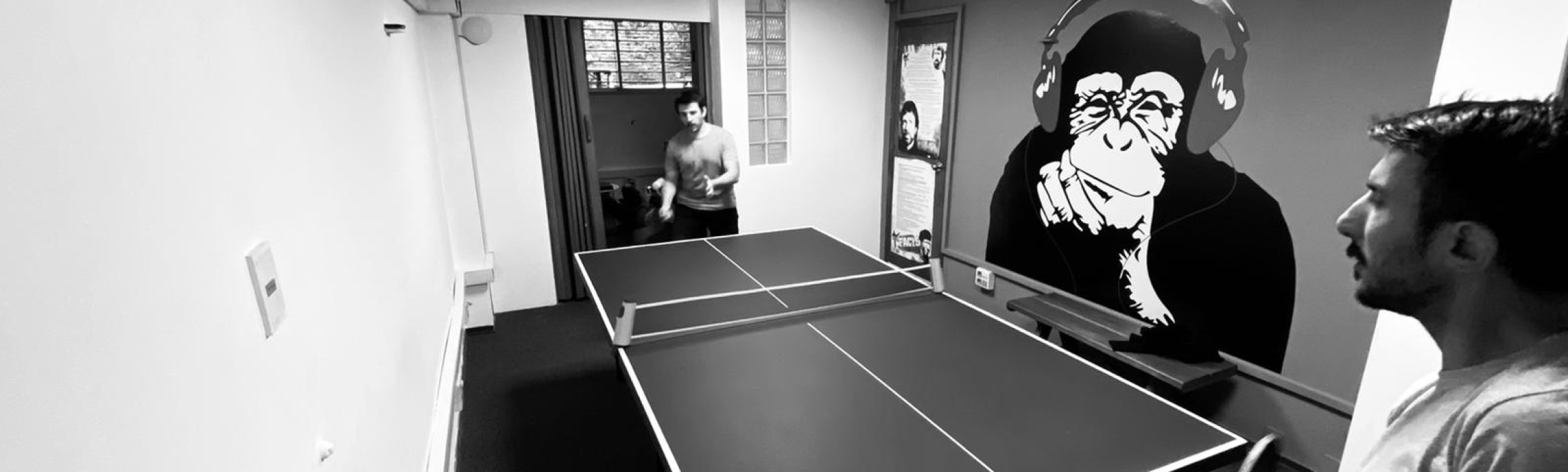 Two guys playing a ping pong match